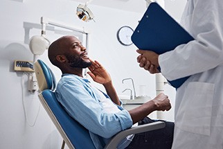 Dentist going over details of root canal with patient