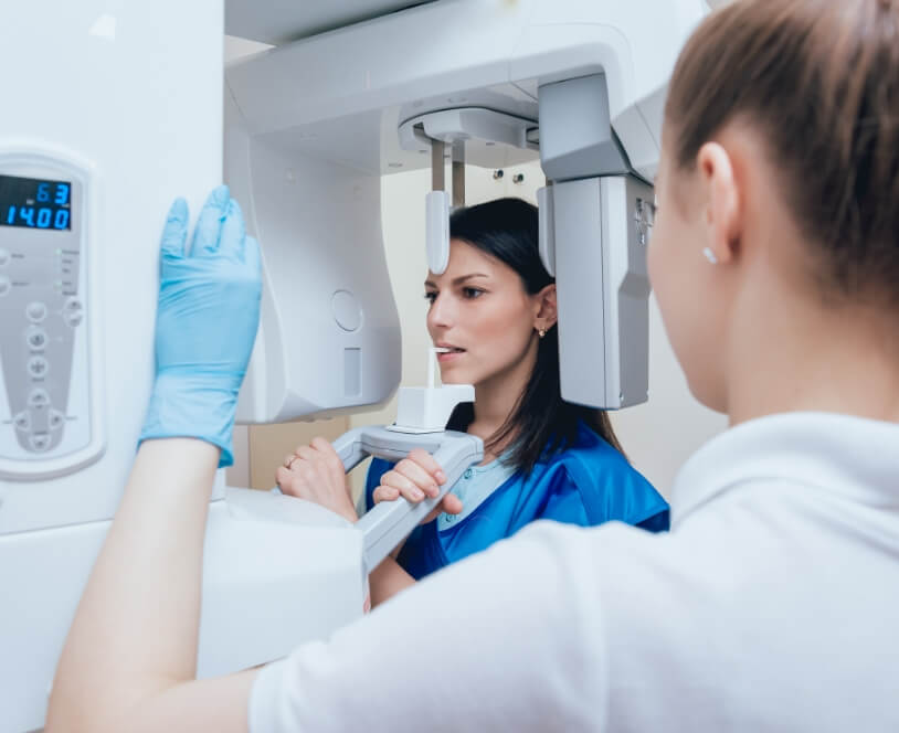 Dental patient receiving 3 D C T cone beam x-ray scans