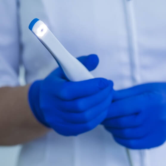 Dentist holding an intraoral camera