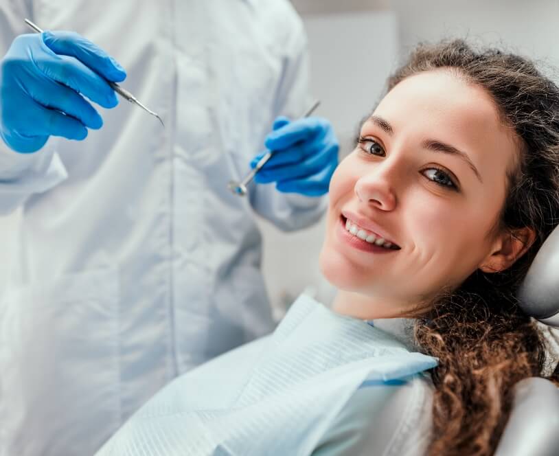 Woman smiling during preventive dentistry visit