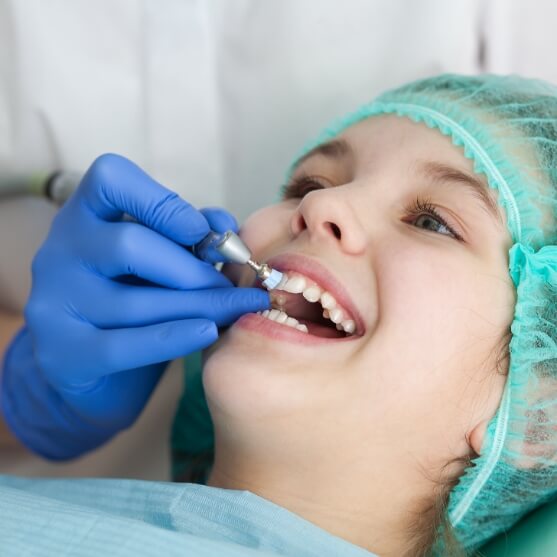 Dental patient receiving fluoride treatment