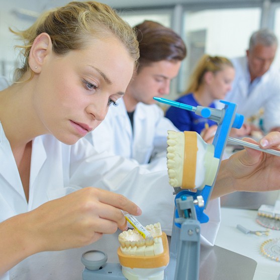 Lab technicians working on dentures