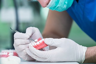 A lab worker creating a denture