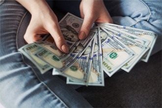 Woman counting cash