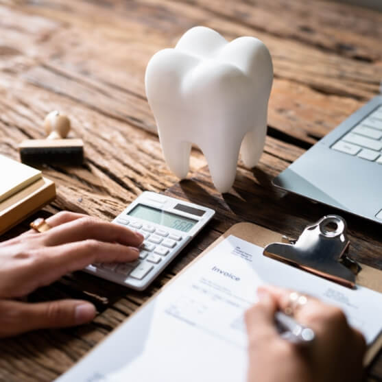 Dental patient filling out dental insurance forms