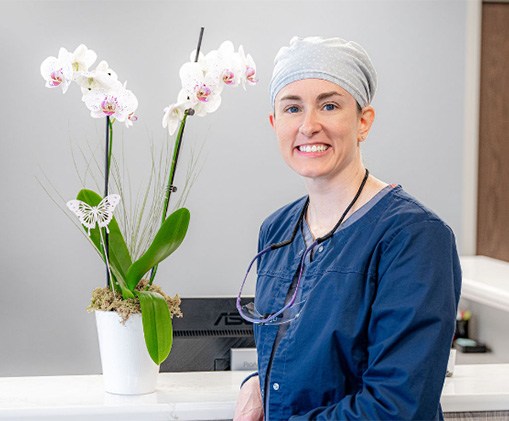 Woman laughing with dentist in dental office