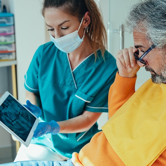Dental patient looking at a tablet